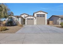 Two-story house with a two-car garage and landscaped front yard at 8026 W Wood Ln, Phoenix, AZ 85043