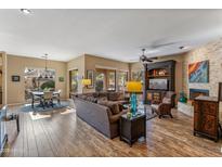 Spacious living room with fireplace and hardwood floors at 27608 N Montana Dr, Rio Verde, AZ 85263