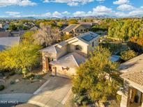 Two-story house with solar panels, desert landscaping, and mountain views at 4516 E Madre Del Oro Dr, Cave Creek, AZ 85331