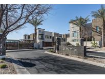Modern community entrance with gated access and stylish architecture at 6924 E Lyra Dr, Scottsdale, AZ 85257