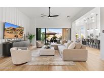 Open living area with large sectional sofa,sliding glass doors, and modern decor at 8040 E Laurel St, Mesa, AZ 85207