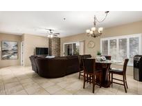 Spacious living room with comfortable seating and a fireplace at 11260 N 92Nd St # 1102, Scottsdale, AZ 85260