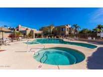 Community pool and spa with surrounding patio at 11260 N 92Nd St # 1102, Scottsdale, AZ 85260