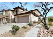 Two-story townhome with attached garage and desert landscaping at 16800 E El Lago Blvd # 1028, Fountain Hills, AZ 85268