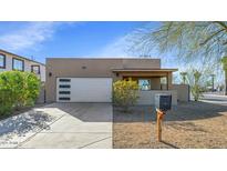 Single-story home with modern facade and attached garage at 3245 W Melvin St, Phoenix, AZ 85009