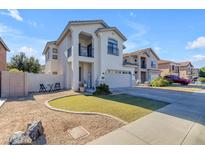 Two-story house with a landscaped yard and attached garage at 5341 E Carol Ave, Mesa, AZ 85206