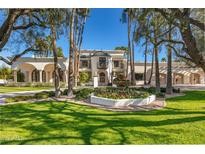 Luxury home with manicured lawn and fountain at 6340 E Huntress Dr, Paradise Valley, AZ 85253