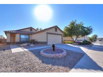 One-story house with a two-car garage and landscaped front yard at 639 W Kingman Loop, Casa Grande, AZ 85122