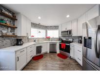 Modern kitchen with white cabinets, stainless steel appliances, and quartz countertops at 17227 E Rand Dr # A, Fountain Hills, AZ 85268