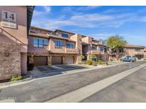 Front view of a two-story building with attached garages and landscaping at 20660 N 40Th St # 2084, Phoenix, AZ 85050