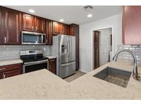 Modern kitchen featuring stainless steel appliances and granite countertops at 4202 E Broadway Rd # 52, Mesa, AZ 85206