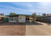 Ranch style home with carport and spacious driveway at 633 W 1St St, Mesa, AZ 85201