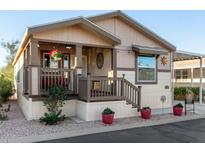 Attractive manufactured home with covered porch and landscaping at 9333 E University Dr # 110, Mesa, AZ 85207