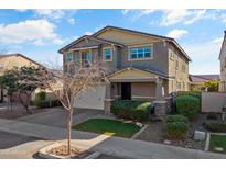 Two-story home with neutral exterior, two-car garage, and landscaping at 9839 E Theia Dr, Mesa, AZ 85212
