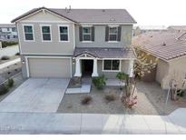 Two-story house with a large front yard and a two-car garage at 10993 W Pierce St, Avondale, AZ 85323