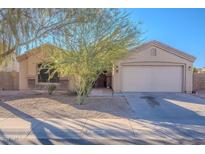 One-story house with attached garage and landscaping at 1227 W Delmonte Dr, Casa Grande, AZ 85122