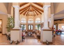 Open living area with high ceilings and a stone fireplace at 15225 N Bluejay Pl, Fountain Hills, AZ 85268