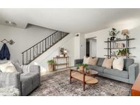 Bright living room with comfy gray sofa and a stylish coffee table at 1531 W Colter St # 10, Phoenix, AZ 85015