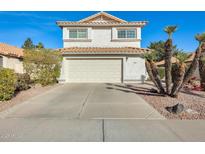 Two-story home with attached garage and desert landscaping at 1610 W Maplewood St, Chandler, AZ 85286