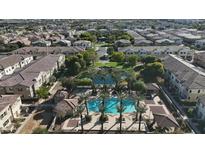 Community pool and surrounding homes aerial view at 1693 E Dogwood Ln, Gilbert, AZ 85295