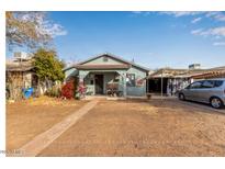 Charming bungalow home with a well-maintained front yard at 2041 N 23Rd St, Phoenix, AZ 85006