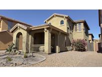 Two-story home with front porch and desert landscaping at 3948 E Morelos St, Gilbert, AZ 85295