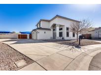 Two-story stucco home with a three-car garage and landscaped front yard at 4333 W Shaw Butte Dr, Glendale, AZ 85304