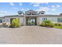 Stunning modern home with brick accents and a large paved driveway at 4602 E Arcadia Ln, Phoenix, AZ 85018