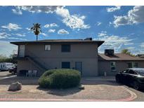 Two-story building with stairs, landscaping, and parking at 4760 E Portland St, Phoenix, AZ 85008