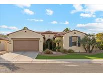 One-story home with a two-car garage and desert landscaping at 4910 S Huachuca Pl, Chandler, AZ 85249