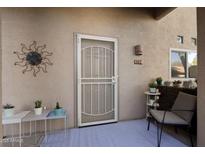 Inviting front entrance with security door, small seating area, and potted plants at 1351 N Pleasant Dr # 1118, Chandler, AZ 85225