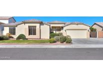 Single-story home with landscaped yard and two-car garage at 2142 W Enfield Way, Chandler, AZ 85286