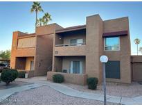 Two-story condo building with desert landscaping and balconies at 2625 E Indian School Rd # 226, Phoenix, AZ 85016