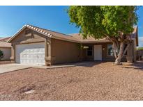 One-story house with a white garage door and desert landscaping at 432 E Harrison St, Chandler, AZ 85225