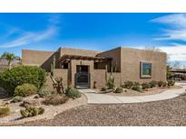 Charming single-story home featuring desert landscaping, a gated front entrance, and a private courtyard at 46827 N 8Th Ave, New River, AZ 85087