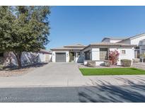 White two-story house with gray garage doors and landscaping at 862 E Gemini Pl, Chandler, AZ 85249