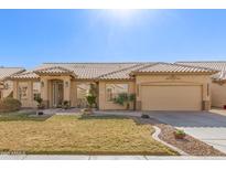 One-story home with tan exterior, tile roof, and landscaped yard at 8833 W Tierra Buena Ln, Peoria, AZ 85382