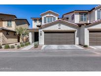 Charming two-story home features a two-car garage and well-maintained landscaping at 1255 N Arizona Ave # 1255, Chandler, AZ 85225