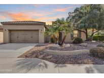 Beautiful desert landscaping highlights this single-story home with a two-car garage at 12629 W Bajada Rd, Peoria, AZ 85383