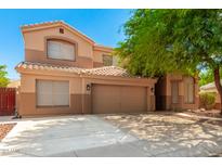 Two-story house with a large garage and mature landscaping at 16205 S 7Th St, Phoenix, AZ 85048