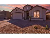 Beautiful one-story home with a two-car garage and desert landscaping at 169 E Canary Ct, San Tan Valley, AZ 85143