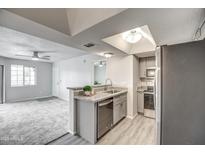 Modern kitchen with stainless steel appliances and granite countertops at 1720 E Thunderbird Rd # 2010, Phoenix, AZ 85022