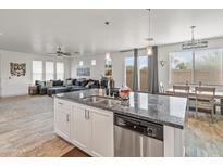 Open kitchen with island, stainless steel appliances, and granite countertops at 17909 N 114Th Dr, Surprise, AZ 85378