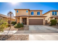 Two-story house with a brown garage door and landscaped front yard at 18475 W Via Del Sol --, Surprise, AZ 85387