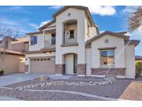 Two-story house with stone accents and a two-car garage at 2327 W Branham Ln, Phoenix, AZ 85041