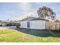 Charming single story home with a well-manicured lawn at 3021 W Ocotillo Rd, Phoenix, AZ 85017