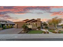 Stunning curb appeal featuring a beautifully landscaped yard and inviting entryway at 3560 E Ironside Ln, Gilbert, AZ 85298