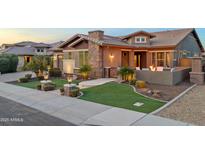 Stunning curb appeal of a single-story home with attractive landscaping and a welcoming entryway at 3560 E Ironside Ln, Gilbert, AZ 85298