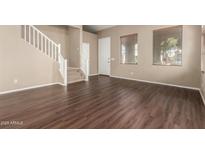 Living room with hardwood floors and a staircase at 5331 E Holmes Ave, Mesa, AZ 85206