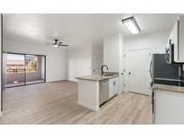 Modern kitchen with granite countertops and stainless steel appliances at 5345 E Van Buren St # 226, Phoenix, AZ 85008